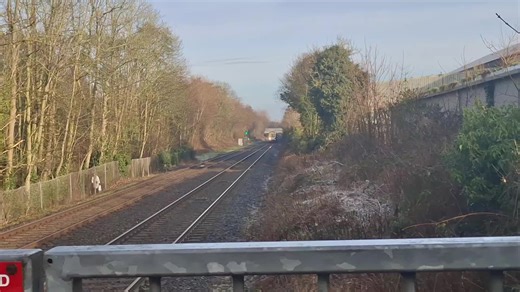 3005 3003 NIR class 3000s zooming past Dunmurry station plat 1 for Dublin connelly 3002 NIR class 3000 sitting in Dunmurry station plat 2 for belfast grand central
