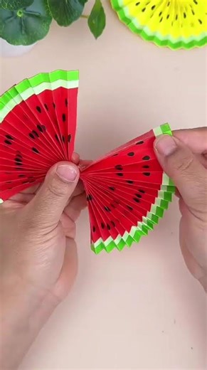 make a toy fan that can be opened and closed from watermelon patterned paper