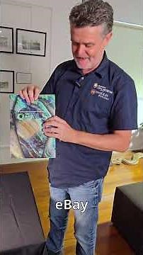 Geoff shows the opal specimens featured on the stamp pack