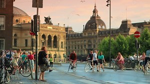 Bicycles and people on a street in Copenhagen, Denmark.