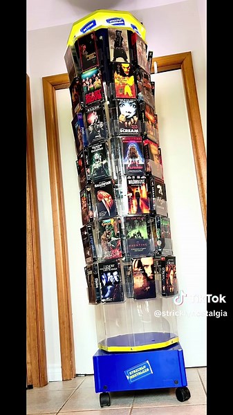 We put this together for a show we have coming up. What do you think? It holds 65 #VHS or #DVDS And gives a little #blockbuster nostalgia vibe. See any movies you remember? #blockbustervideo #horrortok #horrormovies #90s #80s #videostores #videostore #rental