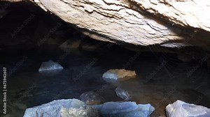 River grotto. A niche in a limestone rock washed out by a spring flood
