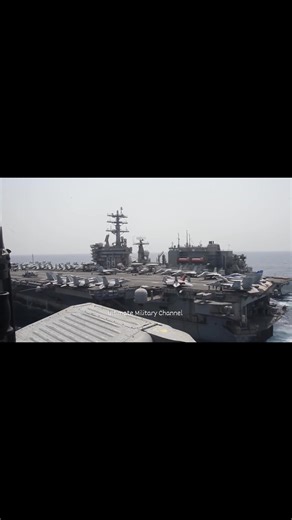 This aerial view showcases the USS Nimitz (CVN 68), a Nimitz-class nuclear-powered aircraft carrier, in remarkable detail. | Ultimate Military Channel
