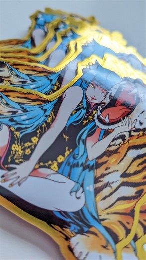 18K views · 34 reactions | She is now a majestic gold foil sticker  I am SO SO happy with how this one turned out! You can find her in my shop with another new entry (Spooky Racer holographic!), plus a restock of most sold out designs and a huuuge discount on old stickers!! ⭐ Happy shopping everyone  . . . . . . . . . . . . #stickers #sticker #stickershop #stickersale #stationery #stationerylove #stationerystore | Jessica Luna | Facebook