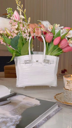 Where high fashion meets home artistry, Anaïs Luxurious Handbag Vases are the couture statement pieces. Designed to hold blooms treasure in the luxury handbags. These vases bring an air of elegance to any space. Transforms florals into wearable art for your home. | Anaïs Candle