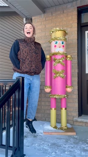 Elizabeth Sparkles on Instagram: "Introducing Norman the Doorman, Cracker of Nuts. 🎄🎅 This 6 foot Nutcracker was made with a concrete form construction tube, PVC pipe, and wood! My wonderful father-in-law helped me build him and then I spent many hours lovingly decorating him. Looking forward to many years of him sparkling on my front porch ✨"