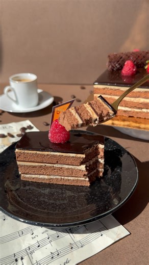 4.9K views · 52 reactions | Enjoy a slice of our new Opera cake for a luscious dessert  Available as an 8” cake or in slices! | 85C Bakery Cafe | Facebook