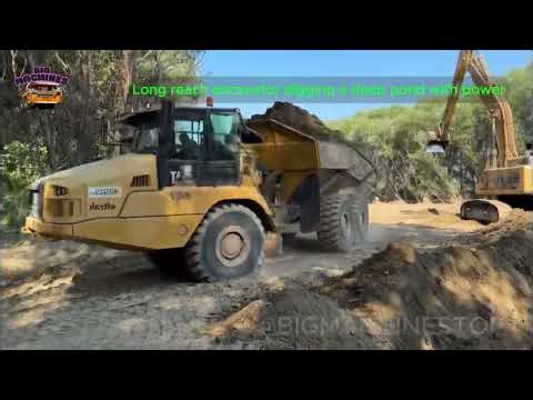 Long Reach Excavator Digging a Pond at Construction Site