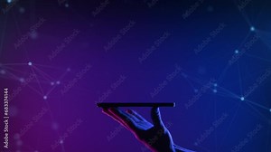 A hand holding smartphone on the neon light background. Mobile application or innovation smart app. Phone side view digital abstract background. Free copy space for name or logo text