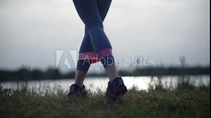 woman exercising outdoors to train muscles and improve strength