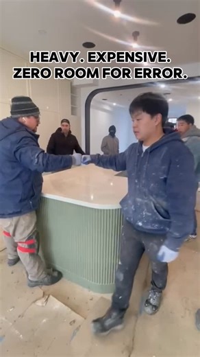 Universal Building Construction on Instagram: "Heavy. Expensive. Zero room for error. This is where teamwork makes the difference. #Teamwork #JumboSlab #LuxuryConstruction #StoneInstallation #BuildWithPrecisiong"