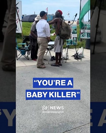 Pro-Palestinian protester confronts man disrupts “Stop Killing Children in Gaza” banner