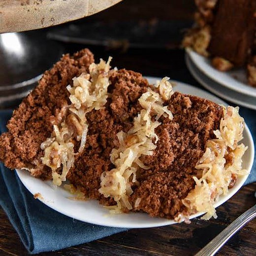 292K views · 164 reactions | Disney's German Chocolate Cake: this famous throwback recipe, for a soft chocolate cake with coconut pecan frosting, was served at Disney World in the 1970’s! It’s so good - you won’t be able to stop at just one slice! RECIPE: https://thenovicechefblog.com/2018/09/disneys-german-chocolate-cake/ | The Novice Chef | Facebook