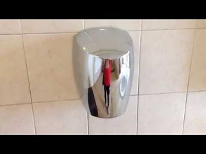 Two jet hand dryers in a public restroom