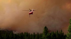 Firefighters battle California's growing Dixie fire