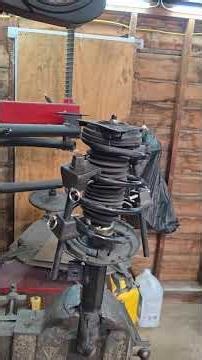 how to remove the top mount (hat) on a strut