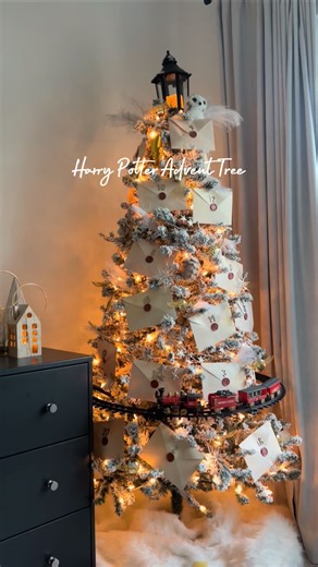 Chelsea Faulkner Vittatoe on Instagram: "You’re a wizard, Harry! 💫 Last year, I created this Harry Potter-themed Christmas tree in my son’s room by repackaging the 2024 Harry Potter LEGO Advent calendar into numbered envelopes, then closing them with red wax seals. 🚂 I painted the viral Walmart tree train to look like the Hogwarts Express and finished it off with DIY jingle bell Snitches, a lamp post tree topper and a Hedwig stuffy! We had so much fun opening the envelopes and building LEGO be