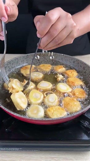 Fried breaded banana with condensed milk.