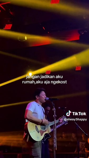 Live Acoustic Guitar Performance with Vibrant Stage Lighting