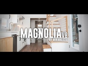 Bright and elegant, this luxurious tiny home features motorized blinds and rooftop deck!