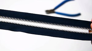 2K views · 72 reactions | See the video below. You may wonder how to change the length of zipper. First, you need have plier to pull off the teeth at the position you want to stop the length.Then, using a pair of alloyed top stop to fill the gap of pulled teeth. Here also need the help of plier. The top stop will bite the tape to avoid the slider slide off. So the finished metal zipper is completed with new length! | Fujian SBS Zipper Science & Technology Co.Ltd. | Facebook