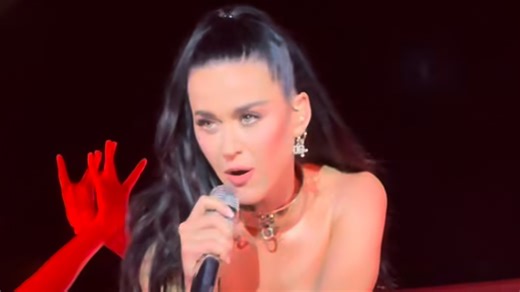 Katy Perry wears silver corset and dog collar at Italy show