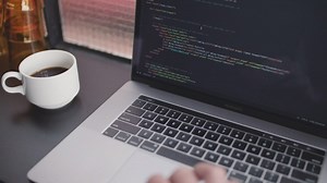 Software developer working while drinks coffee - Free Stock Video