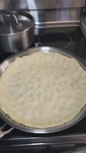 Easy thin crust pizza made on a stainless steel pan. This is thin crust steel pan pizza