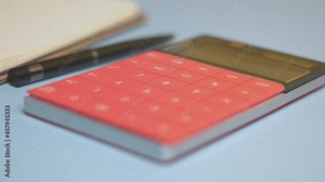 Calculator and notepad on desk. Working space. Close-up view of accountant work desktop