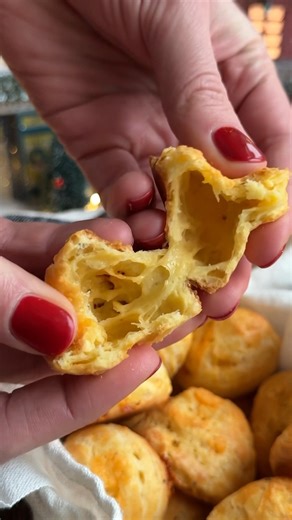 These Cheddar Gougères are essentially French cheese puffs made with choux pastry, and they're absolutely delicious! Crisp on the outside, light, puffed and airy on the inside and perfectly cheesy, these are a lovely appetizer to enjoy with wine or cocktails. Recipe in the comments! | Crowded Kitchen