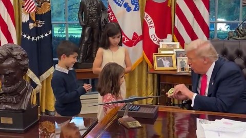 President Trump greets kids visiting Oval Office
