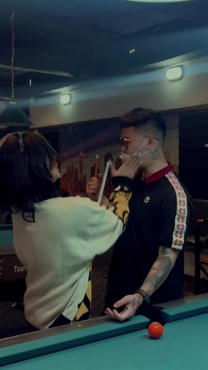 Playing Pool: A Friendly Game in a Relaxed Bar Setting