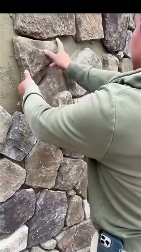 Installing pumice stone in fence construction #shorts #stone #fence