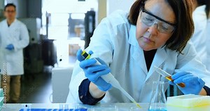 Female scientist experimenting in laboratory 4k