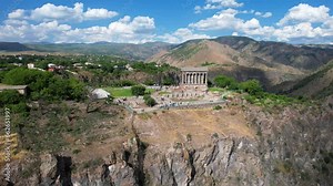 Historic Garni Temple in Armenia. Aerial view Garni Pagan Temple on the rock in Armenia, Caucasus. Ancient archeological ruins in Armenia.