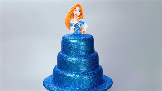 Blue layer cake with character topper