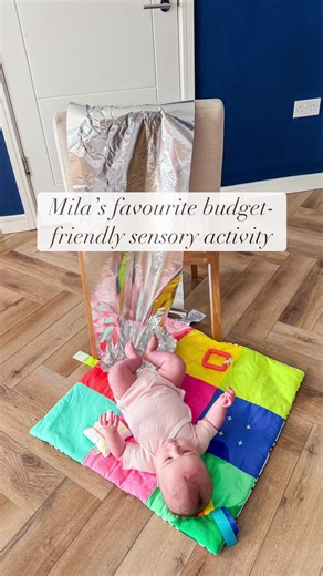 Mila’s favourite budget-friendly sensory activity! 🌟 Simply cover the back of a chair with tinfoil and let little feet explore, kicking it creates a fun texture and crinkly sound! 🎵✨ Tip: Fold over the bottom edge of the foil first to keep it safe—no sharp edges! #SensoryPlay #ToddlerActivities #BudgetFriendlyFun #FineMotorSkills #KidsPlaytime