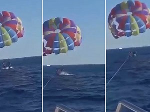 Crazy Footage Of Leaping Shark Grabbing Parasailing Man’s Foot [Video]