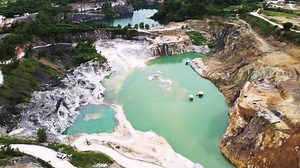aerial photograph of a large pit of a gypsum mine. A large gypsum mine. Mining and Geology Industry Concepts