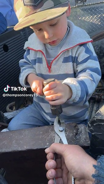 Cowboy Coworking on the Farm with Pliers and Hammer