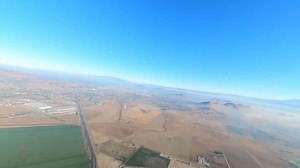 Man jumps from a hot air balloon at sunrise in a wild California wingsuit skydive