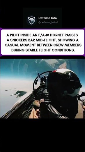 Snickers pass inside an F/A-18 cockpit mid-flight