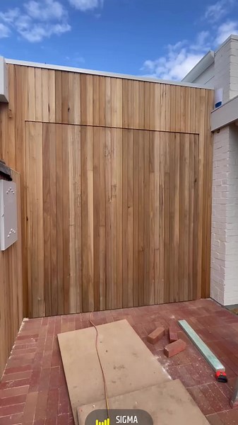 Flush mount tilt door clad with shiplap Vic Ash #custom #newhome #tiltdoor #garagedoor #garage #shiplap #victorianash #new #flush