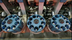 The spinning machinery equipment is in operation in a spinning factory