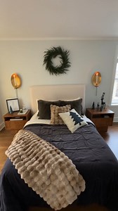 Christmas guest room tour! 🎅 A member of our Crate fam had a vision for how to make their guest room really merry, and the Design Pros at Crate took it to the next level with trees, a holiday village and garland…for FREE! They can help you, too. Just book an appointment online or head to your local store. Pillow arrangements, tree decorating—no holiday project is too big or small! #DesignDesk #DesignServices #GuestRoom #Makeover #HolidayDecor | Crate and Barrel