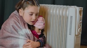 clip-1101079951-shivering-cold-girl-doll-toy-under-blanket