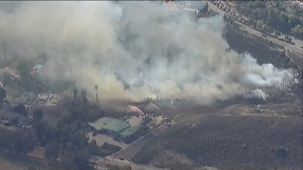 Evacuation warning lifted after crews extinguish brush fire in Poway