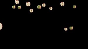 Download Animated 3D Apples Falling and Floating on Black Background - Variety of Whole and Half-Cut Fruits in Motion for free