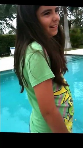 Girl gets pushed in a pool