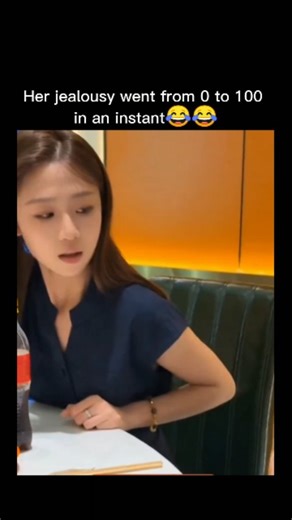 viku on Instagram: "The scene starts with the woman in a white top (on the right, with long dark hair) using chopsticks to feed food from an orange bowl to the woman in a navy blue top (on the left, also with long dark hair). The blue-top woman looks neutral or slightly annoyed as she eats. Subtitles read: "Eat hot pot for about 30 days, feed fish and pigs" (this seems like a poor translation-possibly meaning something like "eat hot pot every day, feeding like animals" or a idiom for overindulge
